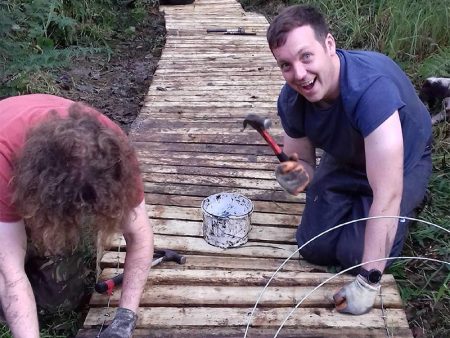 Volunteers constructing a boardwalk